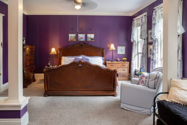 Panel bed with purple walls at the Nordic Pineapple in St. Johns