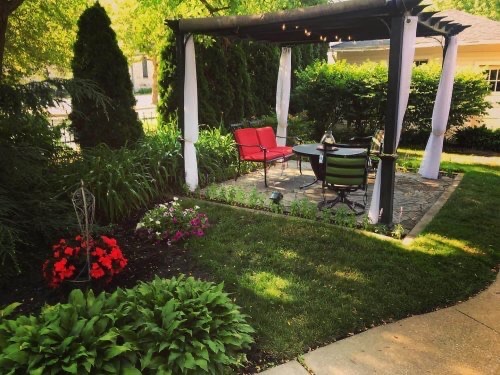 Seating area under pergola at Historic Webster House