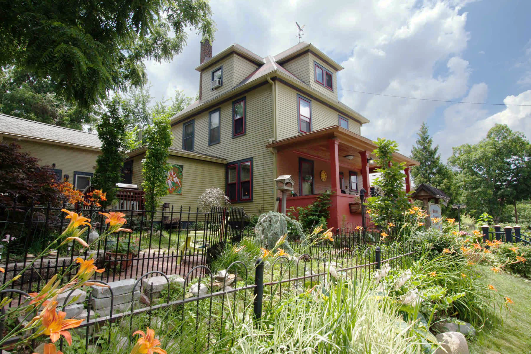 Beige home surrounded by flowers