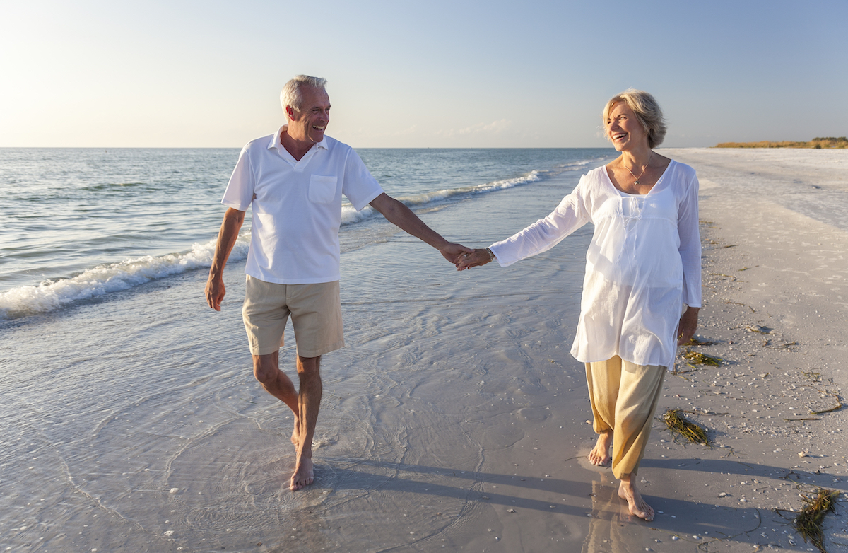 Couple holding hands on a beach