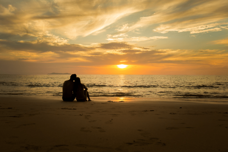 Couple on the beac at sunset