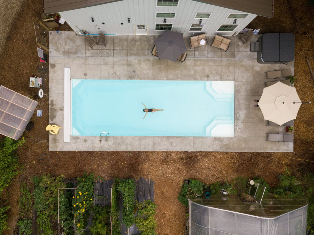 Aerial shot of a woman in a pool at Godberry Woods in Union Pier