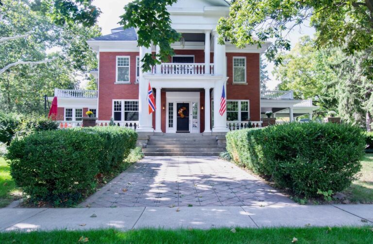 Stately two story brick building with columns- Nordic Pineapple in St Johns