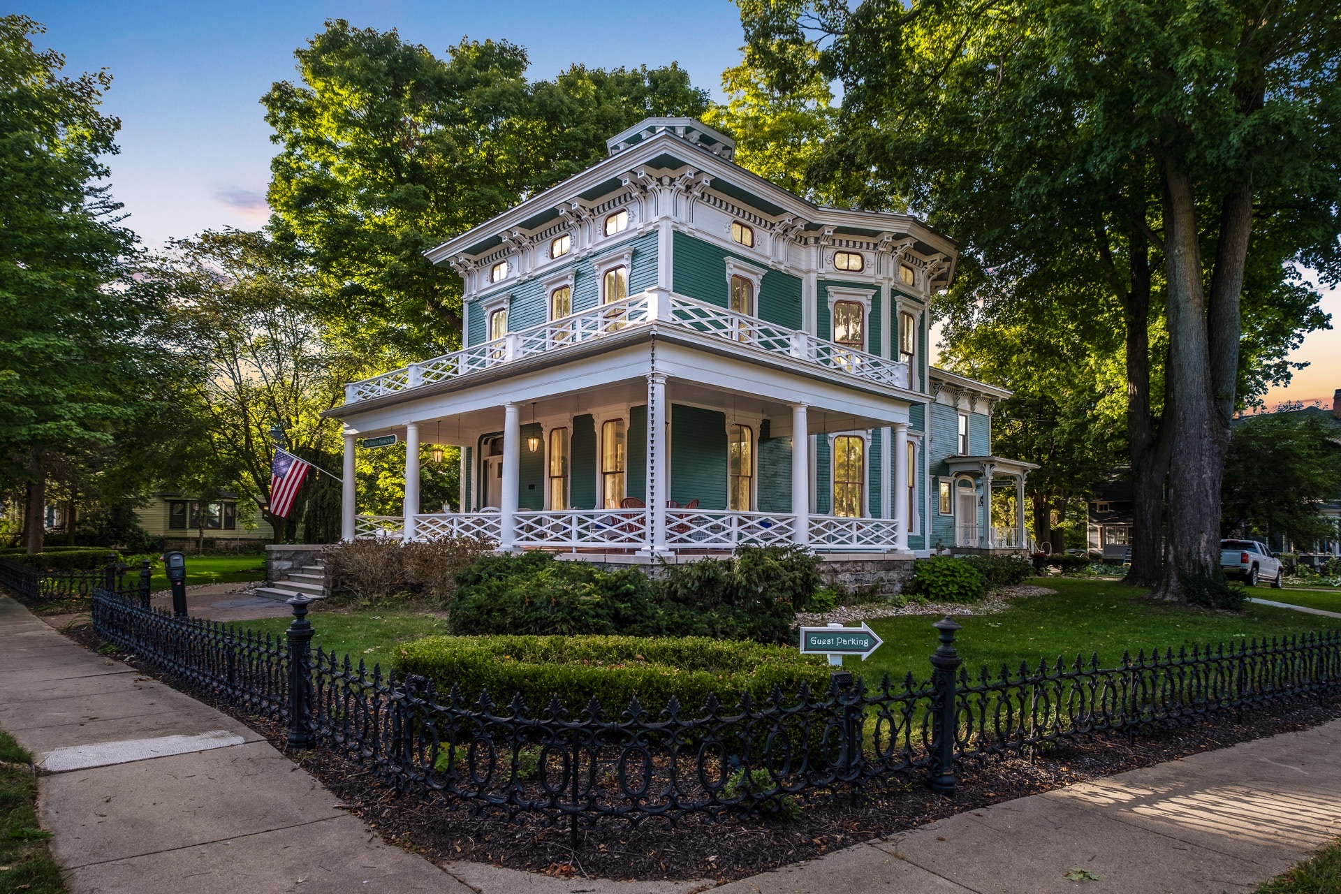 Exterior of Jade Estate Inn. Ornate two story mansion painted green with decorative trim