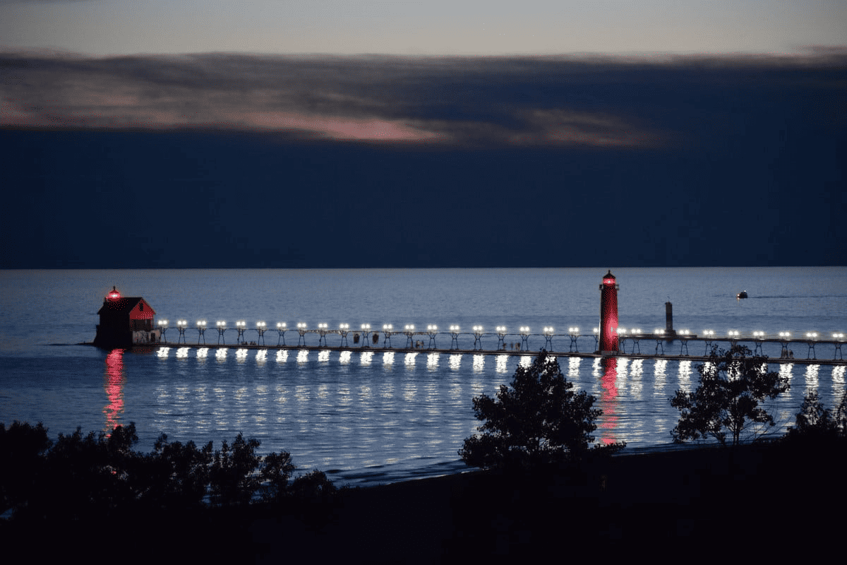 Two lighthouses with a lighted board walk