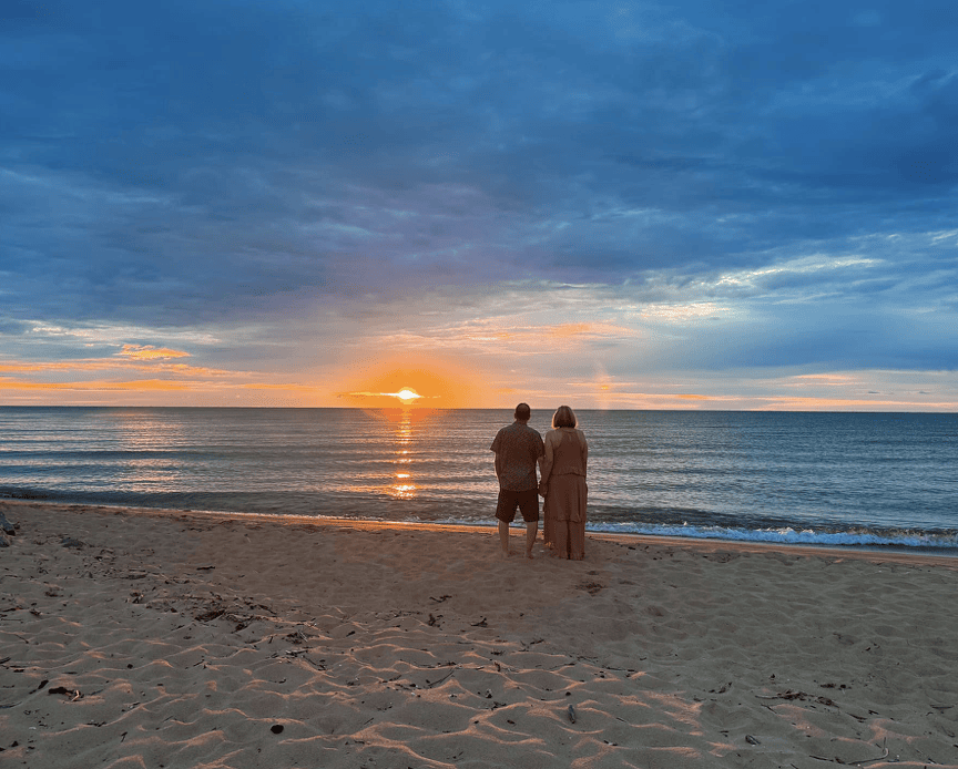 Couple on a beach for sunrise. 