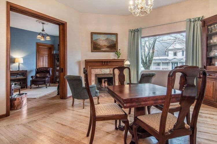 One of the smaller tables where breakfast is now served, in front of the fireplace.