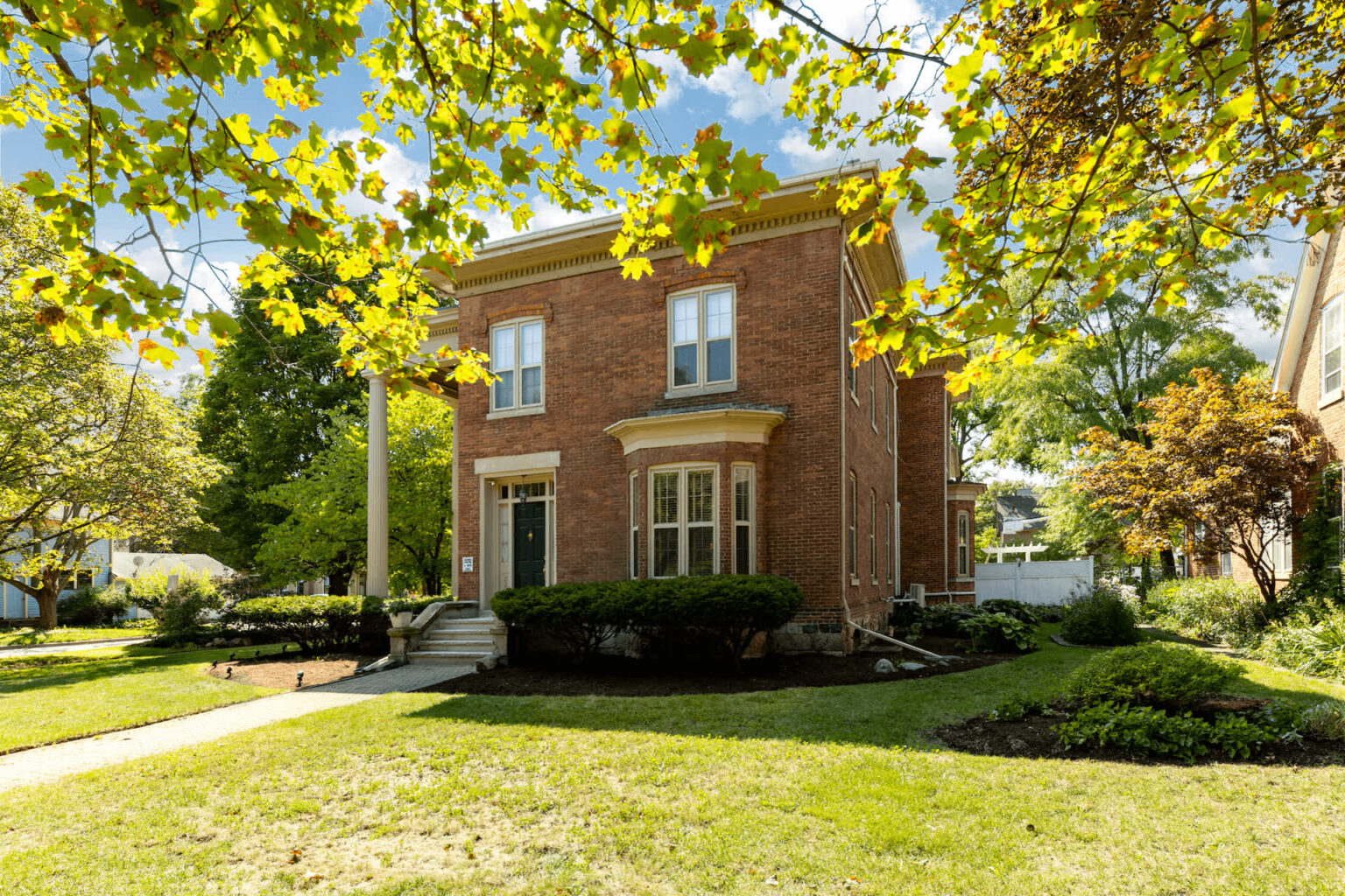 Two story brick building with cream trim, the Newton of Ypsilanti