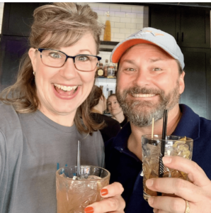 Happy innkeepers having a drink