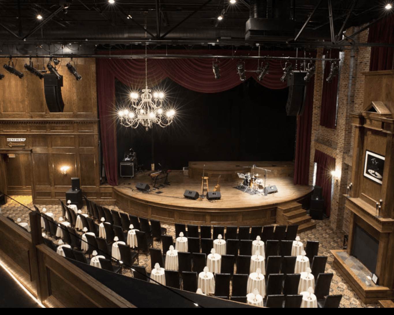 Seating at a Village Theatre with a wooden stage