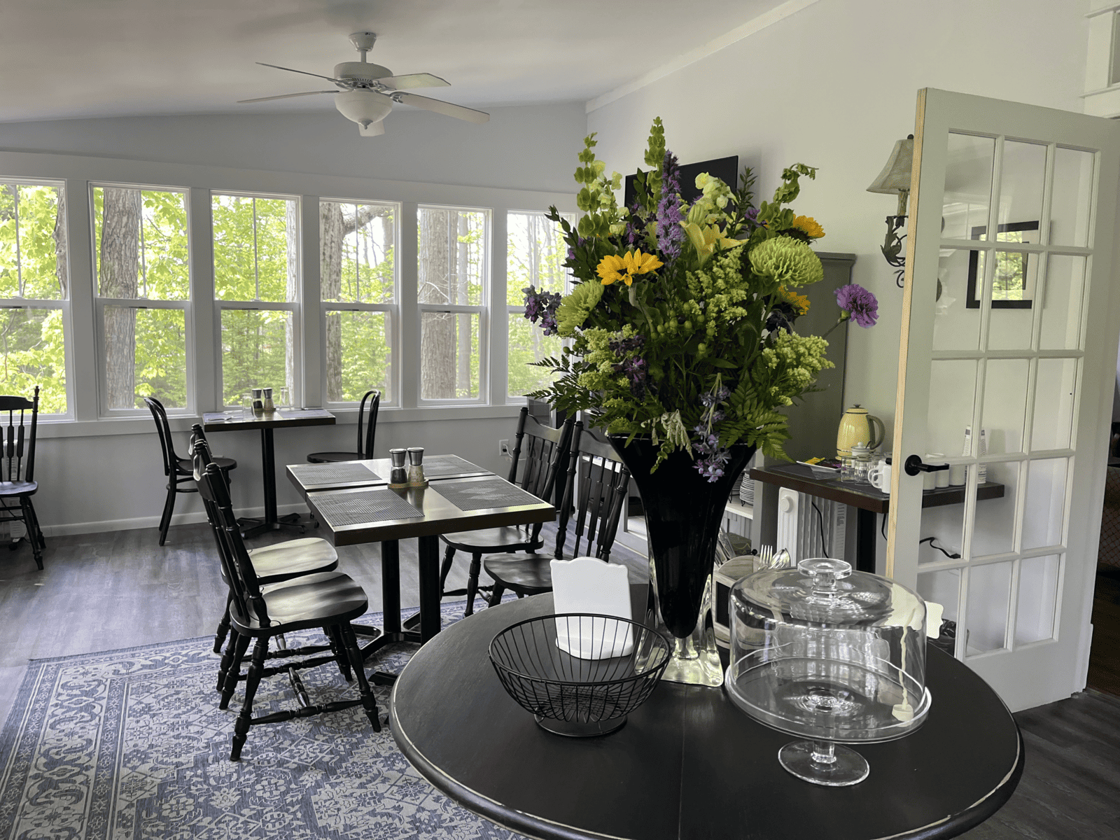 Black Gathering Table with Flowers at the Vintage Inn