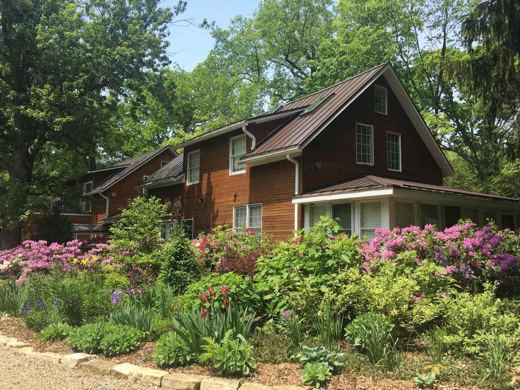 Flower gardens surround the main building at Goldberry Woods.