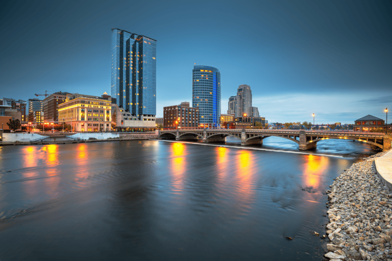 Aerial shot of Grand Rapids with tall buildings, a bridge and river