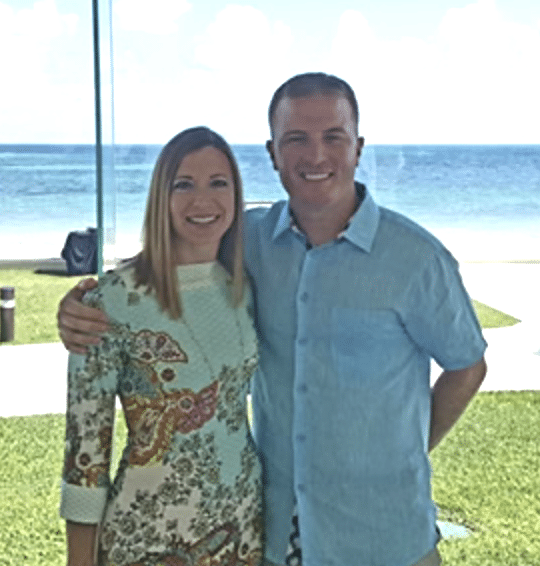 Couple sending in front of a beach - Innkeeper Photo