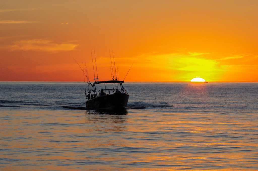 Small fishing boat in Lake Michigan during sunset