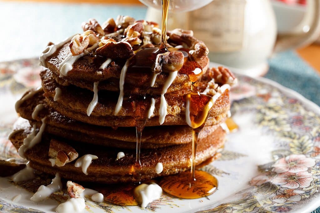 stack of mouthwatering cinnamon pancakes on a decorative plate