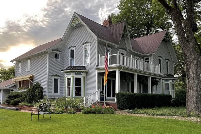 Grey Farmhouse with am American flag