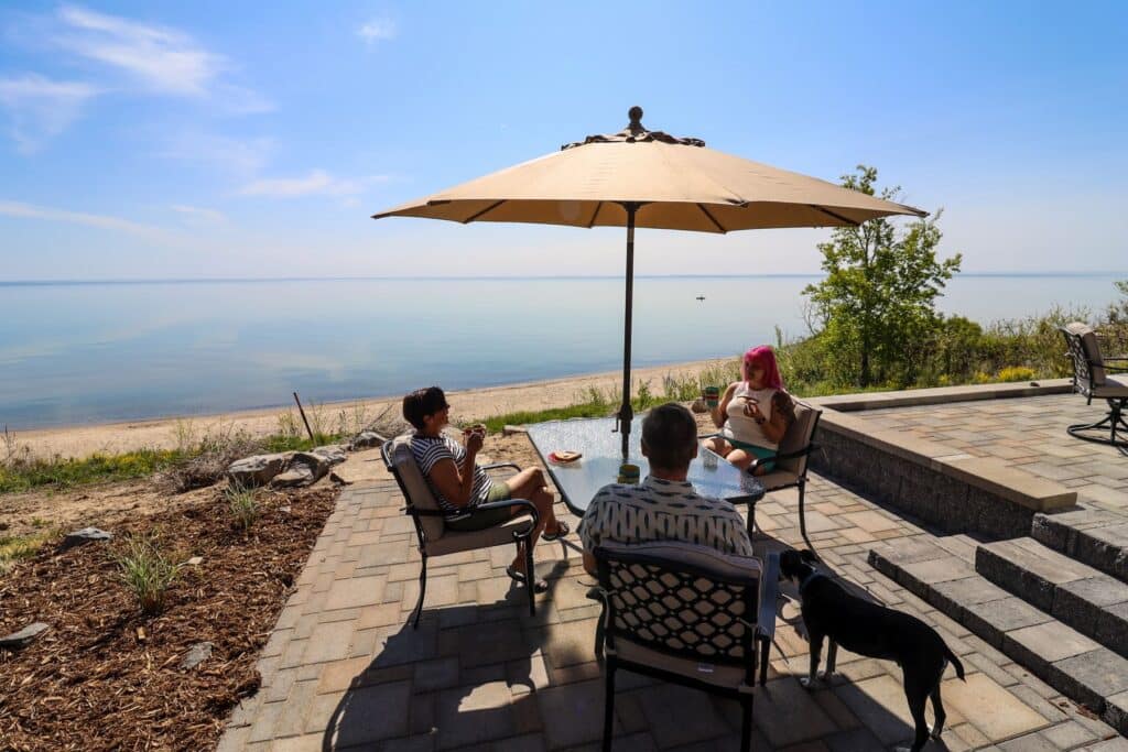 Back patio with an umbrealla at Sweetwater Sea