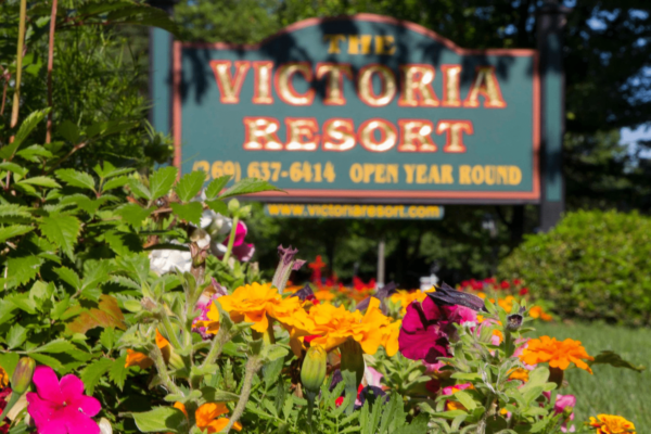 Victoria Resort Sign with summer flowers