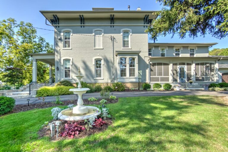 Villa on Verona Bed and Breakfast / Boutique Hotel, Front of building in summer with flowers and antique fountain