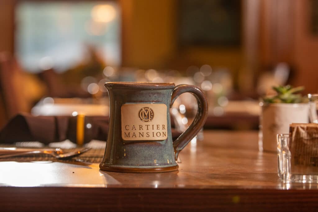 Cartier Mug on a chess board at Cartier Mansion