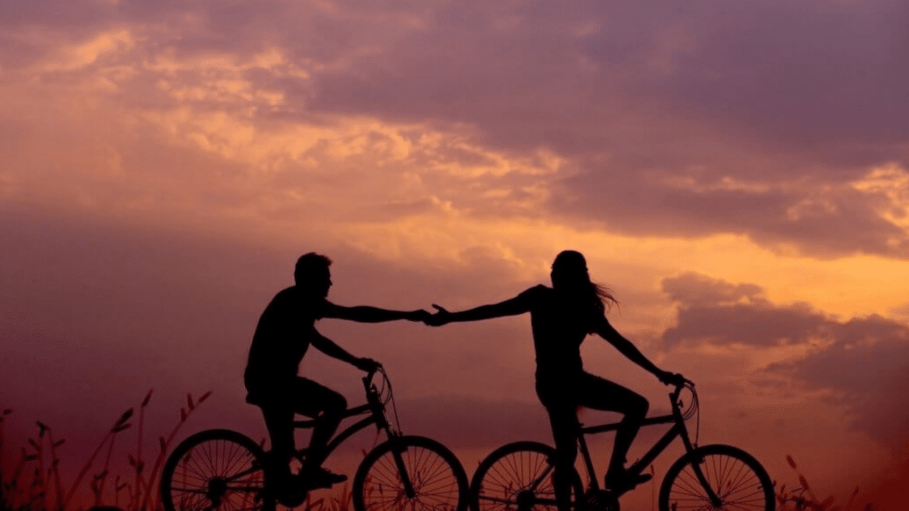 Couple Riding bikes in the sunset - used for submitting offers to MBBA hdr banner page