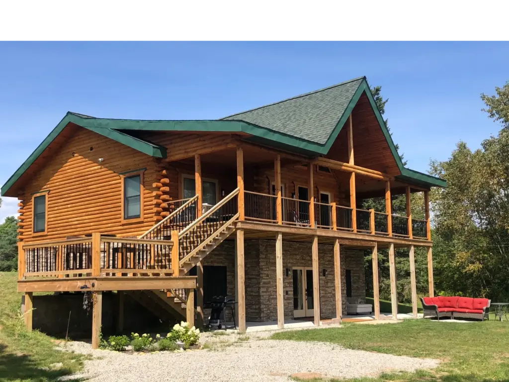 Nahma Pines Cabin and Bed and breakfast rear view of building in summer.