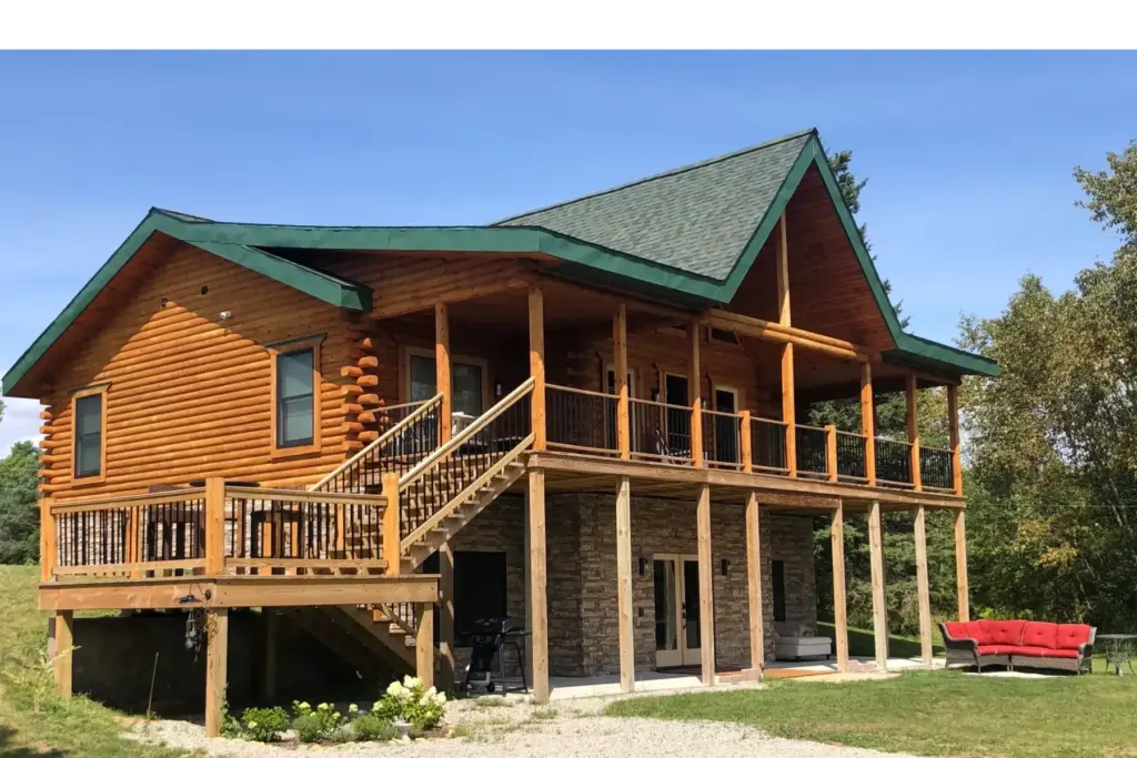 Nahma Pines Cabin and Bed and breakfast rear view of building in summer.