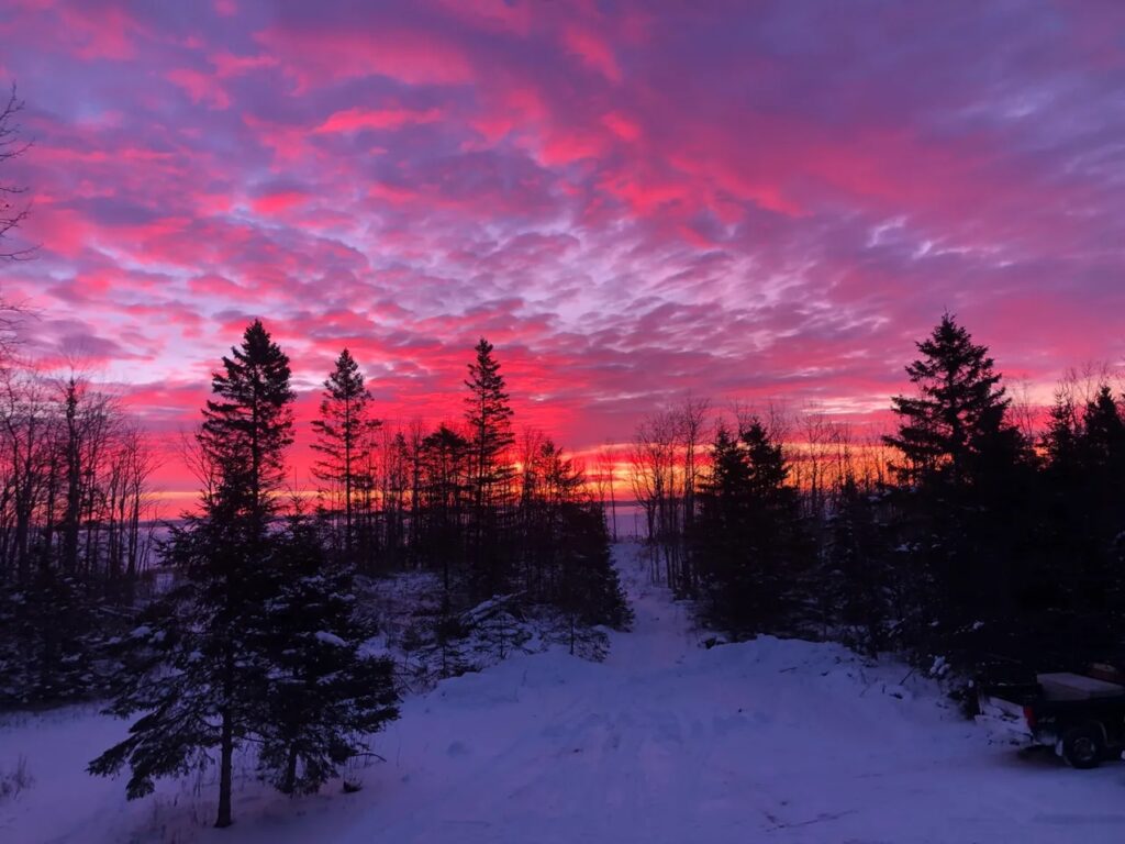 Sunset at the Nahma Pines Cabin B&B, a star gazing escape