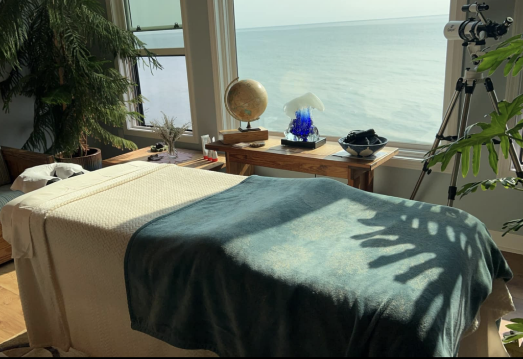 Spa table at the Sweetwater Sea with lake views in the background