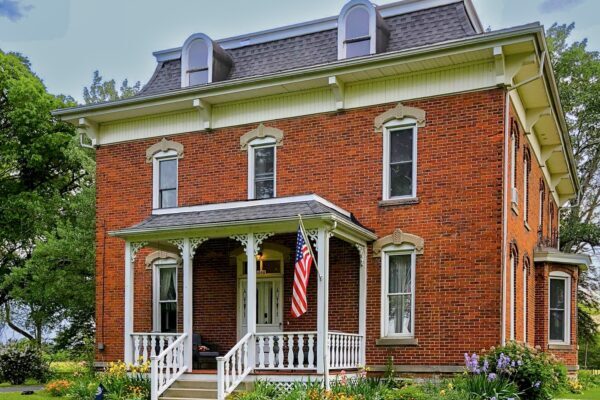The Vine Bed and Breakfast - Mansard roof, Brick Building and great covered porch.
